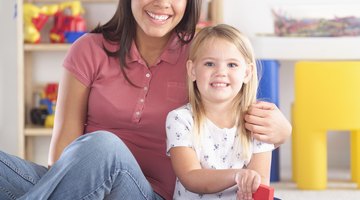 Portrait of a childcare professional and child