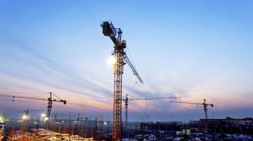 buildings under construction with sunset