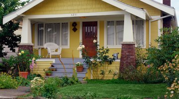 Yellow bungalow style house with garden, exterior view
