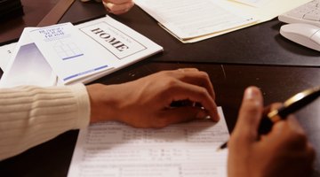 Man and woman signing documents at desk in office, close-up of hands, mid section