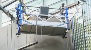 Empty hanging scaffold on a building wall