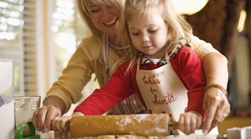 Mother and daughter baking cookies