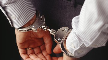 Man in handcuffs, rear view, mid section, (Close-up)