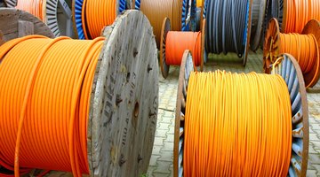 wires of electrical cable on wooden spool